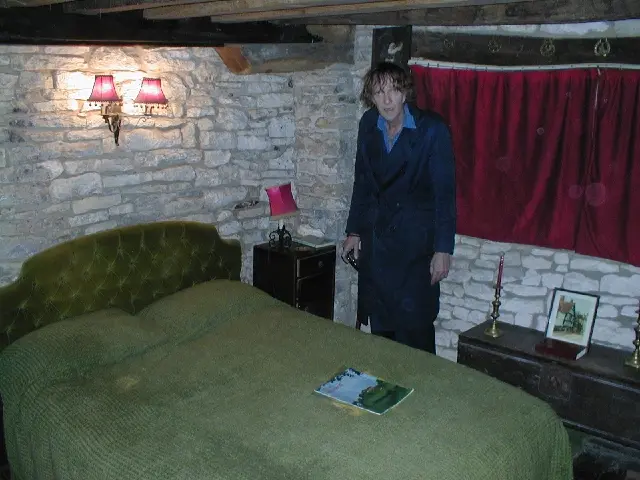 Psychic investigator David Farrant standing in the haunted ‘Bishop’s room’. You can see orb-like manifestations to David’s left